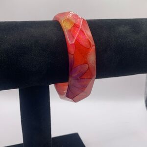 Vintage pink bangle bracelet with purple flowers